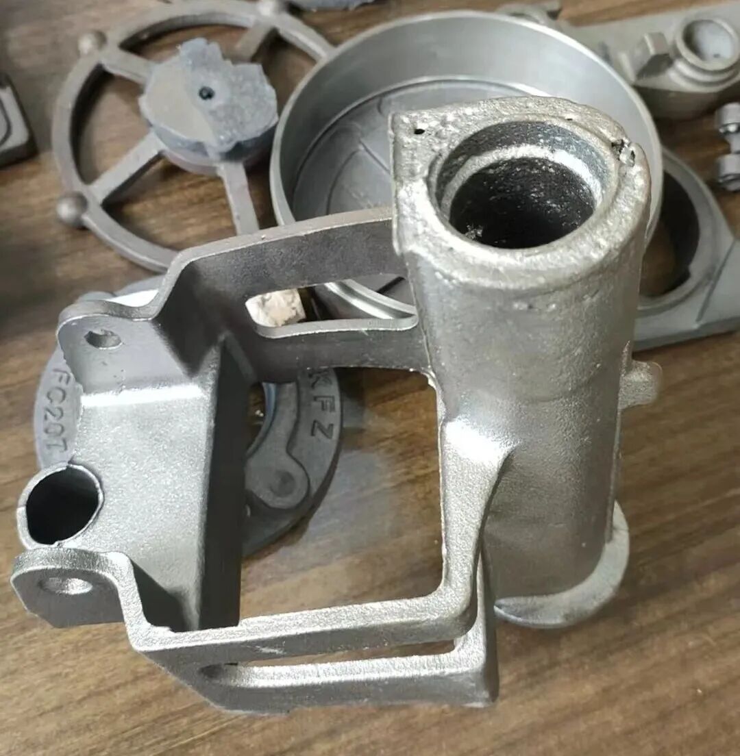 Tratamento para porosidade severa em núcleos de areia tubulares cilíndricos durante a produção de peças de ferro dúctil usando tecnologia de moldagem em areia verde